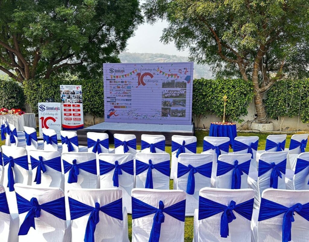 Corporate Event Venue in Gurgaon with Outdoor Stage Setup at Hridhya Farmhouse